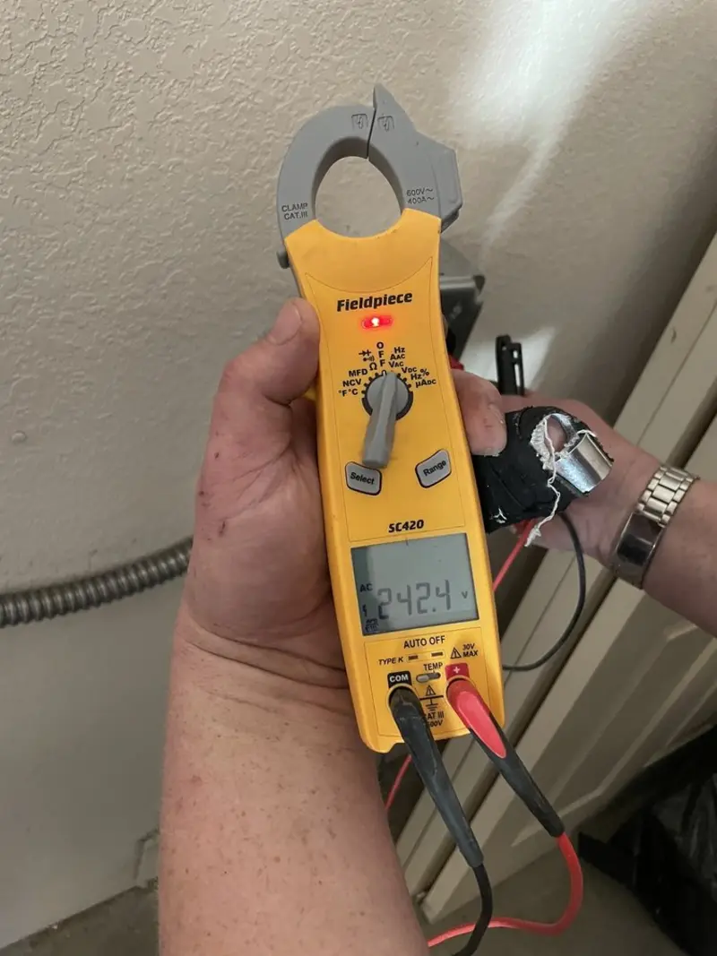 Voltage testing with clamp meter during Electrical Installation Services in Mojave
